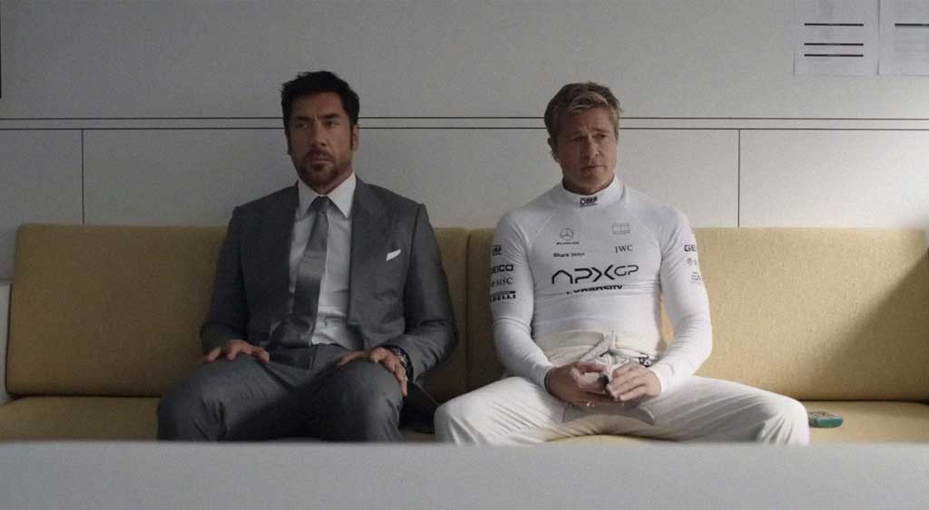 Ruben Cervantes sentado ao lado do seu ex-colega de Fórmula 1 e amigo, Sonny Hayes - segurando o seu baralho de cartas da sorte. O piloto Sonny é a última jogada decisiva de Ruben para salvar a sua equipe de Fórmula 1, APXGP, da falência. 